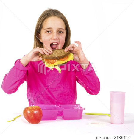 Schoolchild is eating healthy lunch 8136116