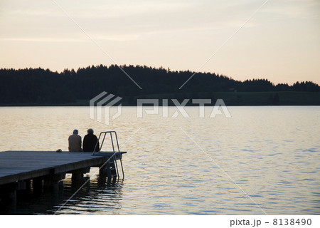 elderly couple by sunset 8138490