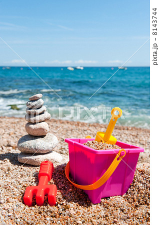Pile of stacked stones with toys 8143744