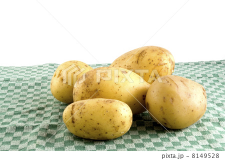 Potatoes on a green tea-cloth Potatoes on a green tea-cloth 8149528
