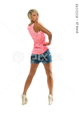 Sexy girl in denim shorts looks back at the studio. View from th Sexy girl in denim shorts looks back at the studio. View from th 8152149
