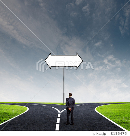 Businessman at crossroads 8156476
