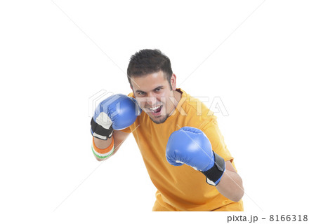 Portrait of young male boxer in a fighting stance over white background Portrait of young male boxer in a fighting stance over white background 8166318