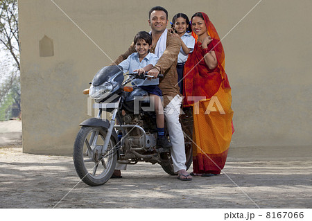 Portrait of a happy Indian family on bike 8167066