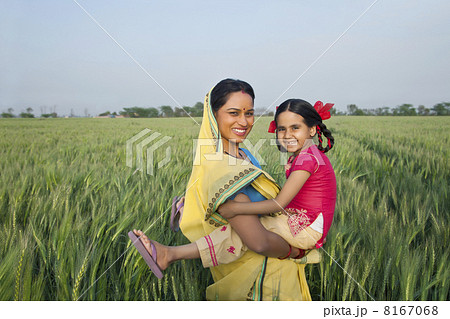 Portrait of a cheerful mother and daughter in the field 8167068