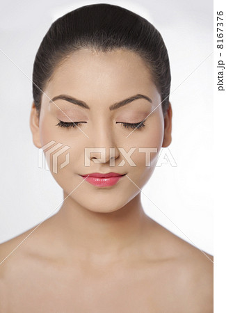 Young woman with eyes closed over white background 8167376