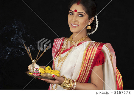 Portrait of Bengali woman with puja thali 8167578