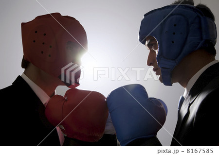 Businessmen with boxing gloves facing each other 8167585