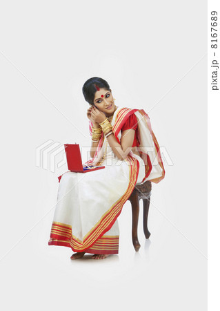 Bengali woman wearing jewelery Bengali woman wearing jewelery 8167689