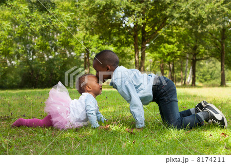 African boy is kissing his sister African boy is kissing his sister 8174211