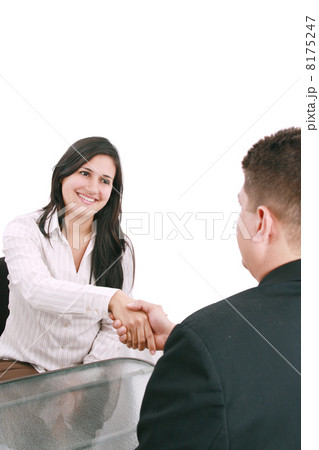 Two businesspeople, or business person and client handshaking at Two businesspeople, or business person and client handshaking at 8175247
