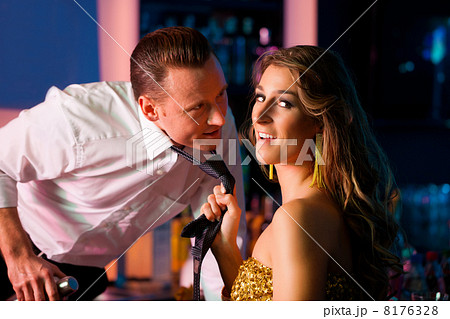 Woman dragging barkeeper in club Woman dragging barkeeper in club 8176328
