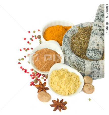 mortar with spices isolated on white mortar with spices isolated on white 8178804