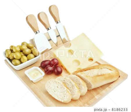 Set for cutting cheese and snacks for wine. On a white backgroun 8186233