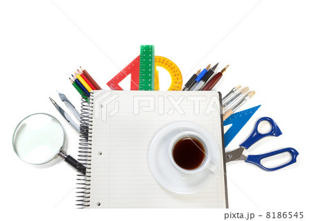 A set of office tools on the notebook for notes and a cup of cof A set of office tools on the notebook for notes and a cup of cof 8186545