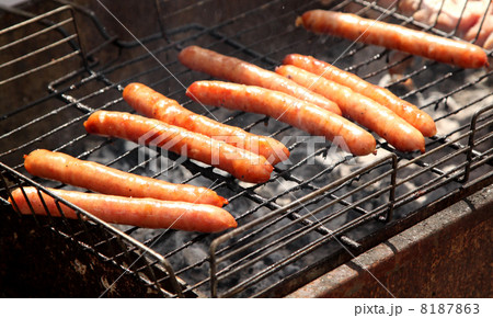 A few sausages on grill closed-up. A few sausages on grill closed-up. 8187863
