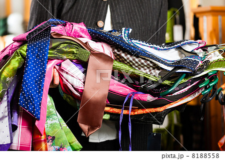 Man is buying Tracht or dirndl in a shop 8188558