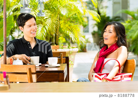 Asian man and woman in restaurant or cafe Asian man and woman in restaurant or cafe 8188778