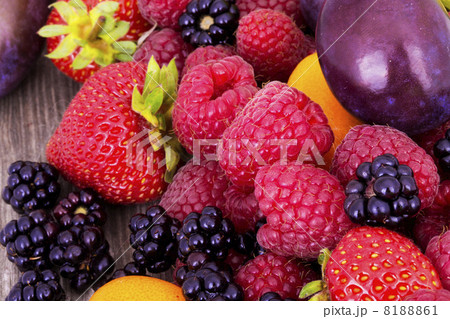 tasty summer fruits on a wooden table 8188861