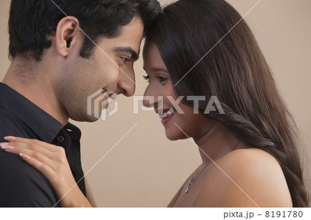 Close-up of romantic young couple looking at each other Close-up of romantic young couple looking at each other 8191780