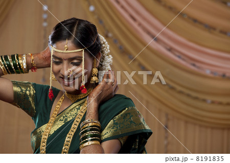 Smiling Maharashtrian bride getting ready for the wedding Smiling Maharashtrian bride getting ready for the wedding 8191835