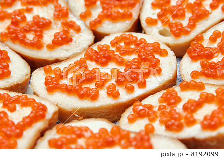 bread and butter with red caviar. Gourmet food 8192099