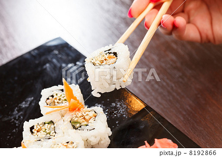 sushi with chopsticks sushi with chopsticks 8192866