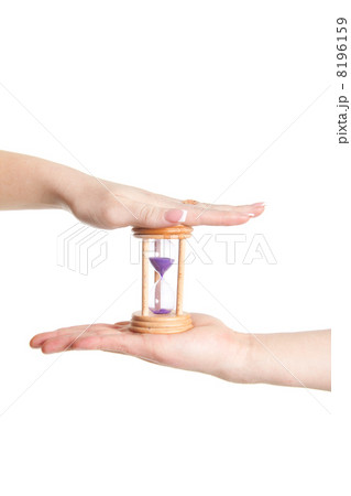 man and woman hands holding Hour Glass 8196159
