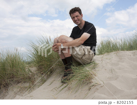 Man at a dune (Borestranda beach, Kleppe, Norway) Man at a dune (Borestranda beach, Kleppe, Norway) 8202155