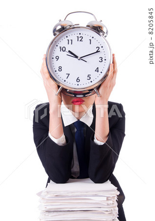 Woman businesswoman with giant alarm clock 8205845