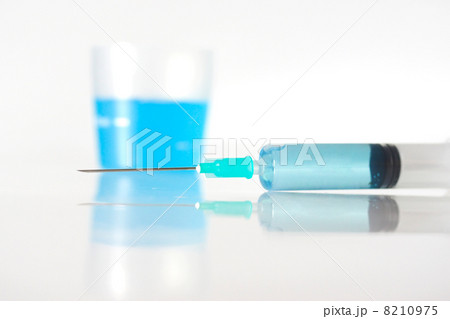 Syringe with blue liquid Syringe with blue liquid 8210975