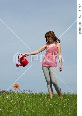 Watering the flowers Watering the flowers 8219147