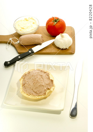 half roll for breakfast on a white plate 8220428