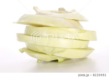 one kohlrabi cut into slices and white background one kohlrabi cut into slices and white background 8220491