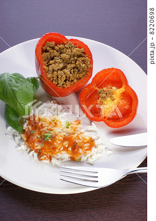 Red mince filled paprika with basil leaf, rice and sauce 8220698
