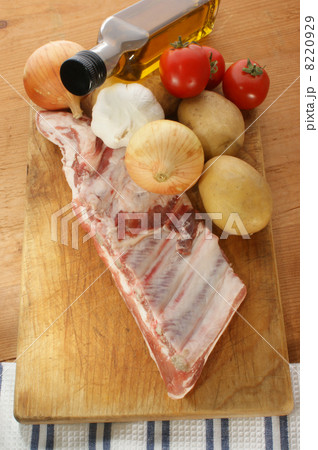 pork ribs with some vegetables on a timber board pork ribs with some vegetables on a timber board 8220929