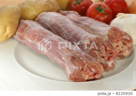 raw turkey neck with vegetables on a plate raw turkey neck with vegetables on a plate 8220930