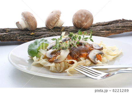 Pasta with mushroom and herbs on a white plate 8221289