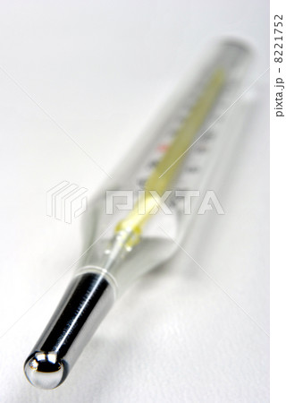 analogue clinical thermometer on a white background 8221752