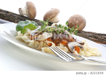 Pasta with mushroom on a white plate 8221839