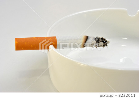 one unhealthy cigarette in a glass ashtray 8222011
