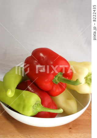 red, green and yellow paprika in a bowl red, green and yellow paprika in a bowl 8222435