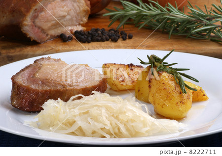 Roast pork with roast potatoes and sauerkraut 8222711