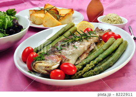 grilled rainbow trout with asparagus on a plate grilled rainbow trout with asparagus on a plate 8222911