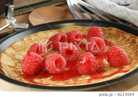 home made pancakes with fresh organic raspberries 8223004