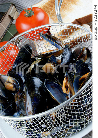 cooked mussels in a colander with tomato cooked mussels in a colander with tomato 8223244