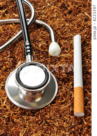 some unhealthy tobacco cigarette and a stethoscope 8223397