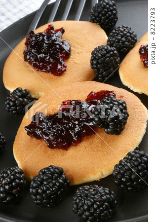 home made pancakes with fresh blackberries and jelly 8223793