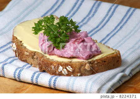 red organic herring salad on soda bread 8224371