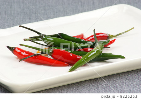 green and red hot pepper on a plate green and red hot pepper on a plate 8225253